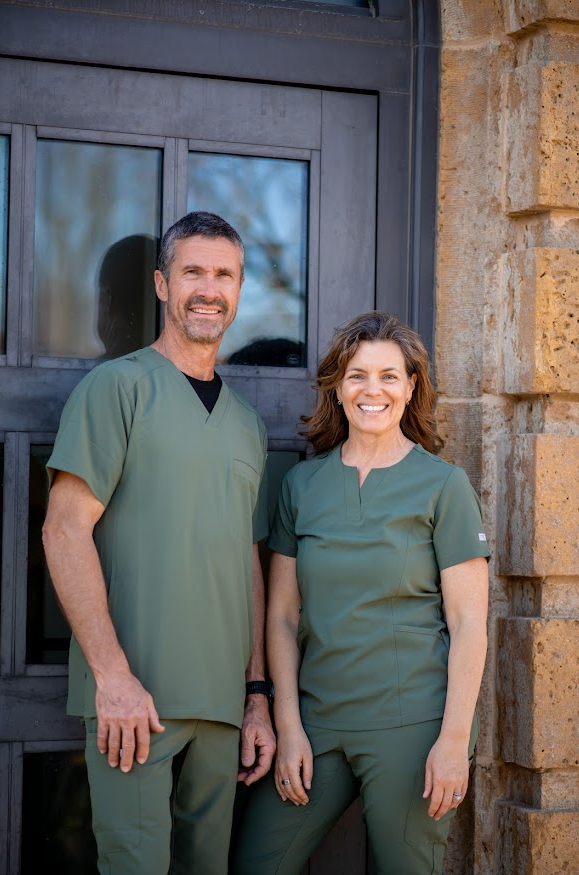 Dr. Mark and Tandi Hechler outside Unity Tower
